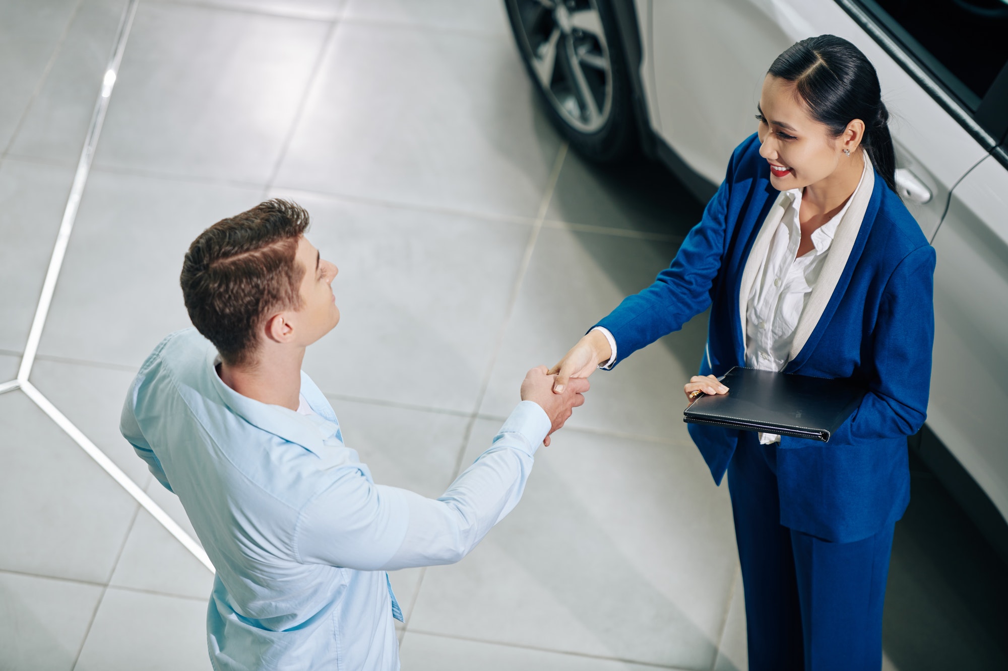 Manager greeting customer